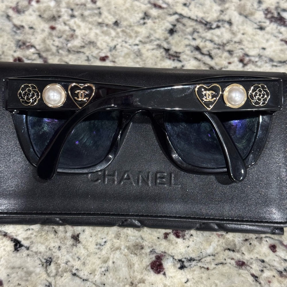 CHANEL Black and Gold Sunglasses with Signature Embellishments